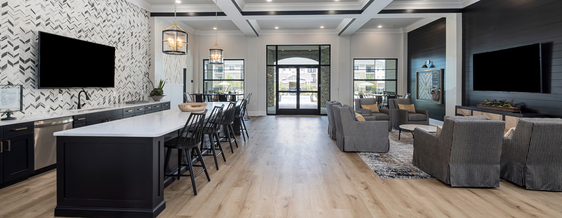 room with a long table chairs and tv on the wall